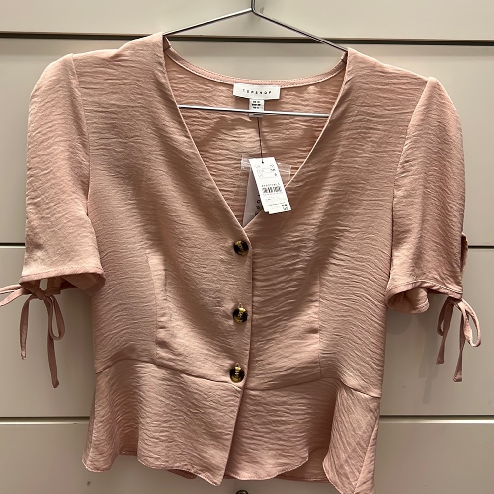 TOP SHOP: NWT pink button down blouse with ties on the sleeves!